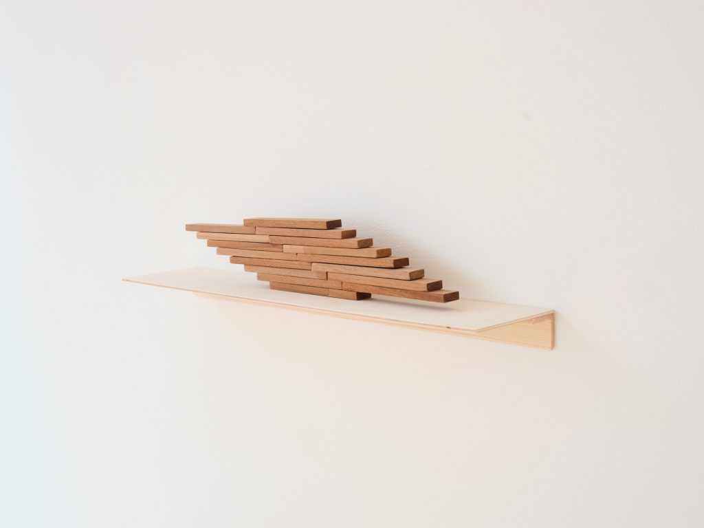 wooden sculpture on wall