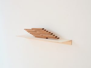 wooden sculpture on wall