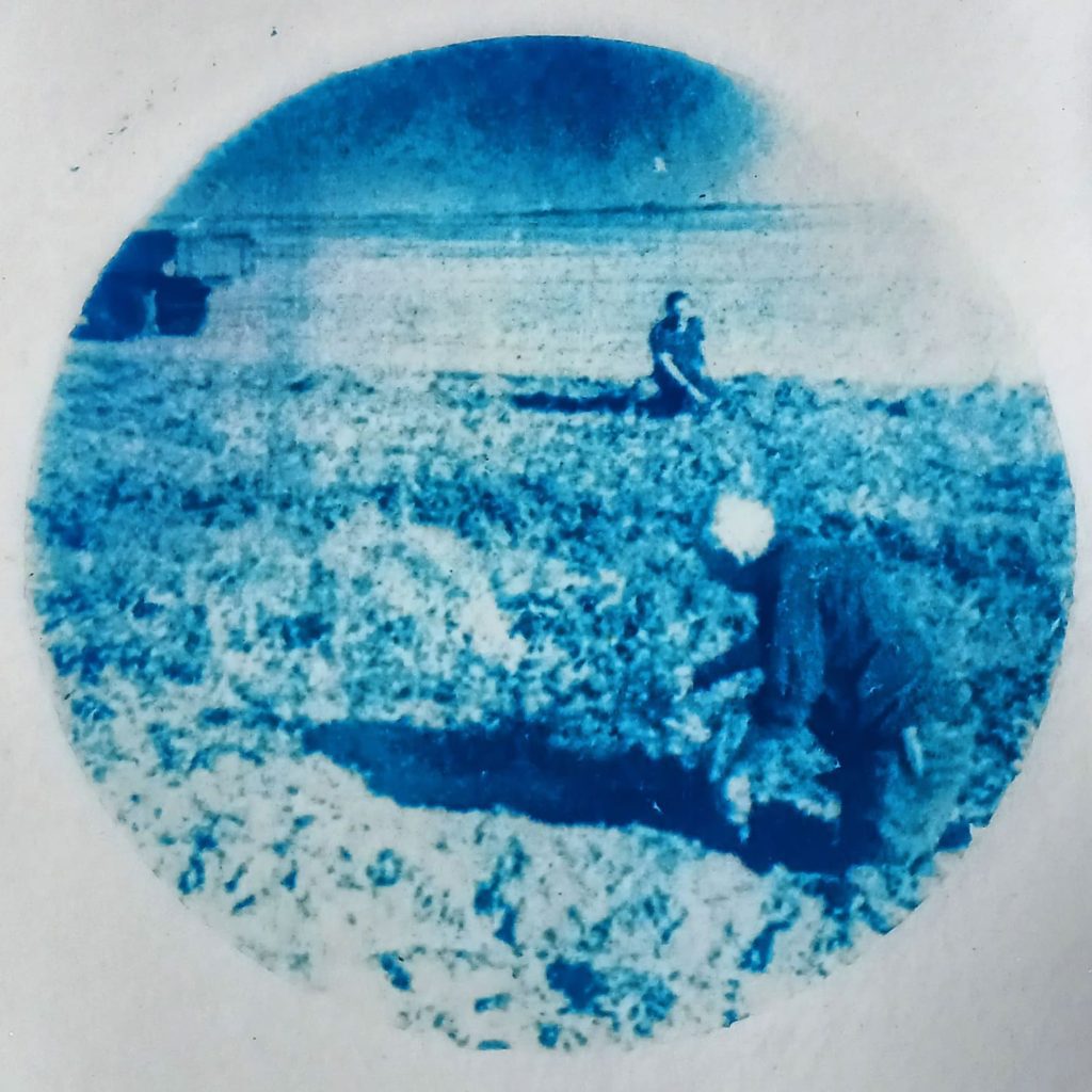 Cyanotype of potato pickers, created from a digital negative of a Caffinol developed 120 film image.