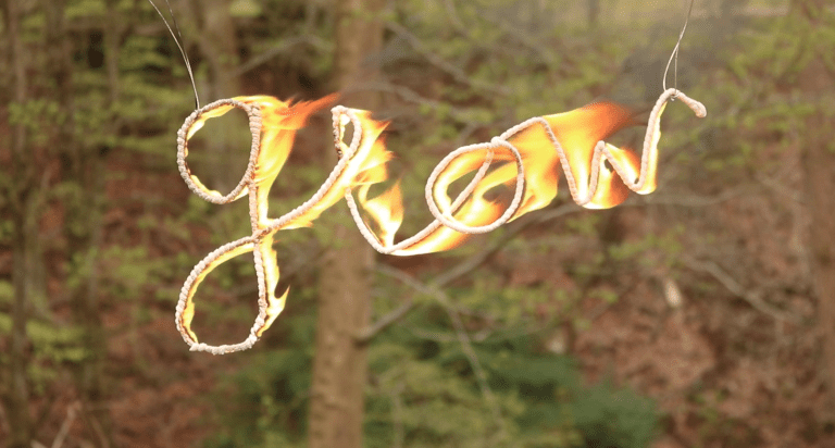 text "glow"on fire in woodlands