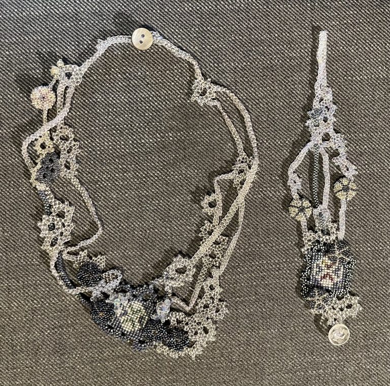 Silvery grey, organic bead woven necklace and cuff bracelet with elements of fair isle and beaded seaurchins