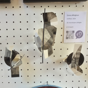 3 objects made from monoprinted paper, cut ans assembled in abstract forms. They are pinned to a white peg board.
