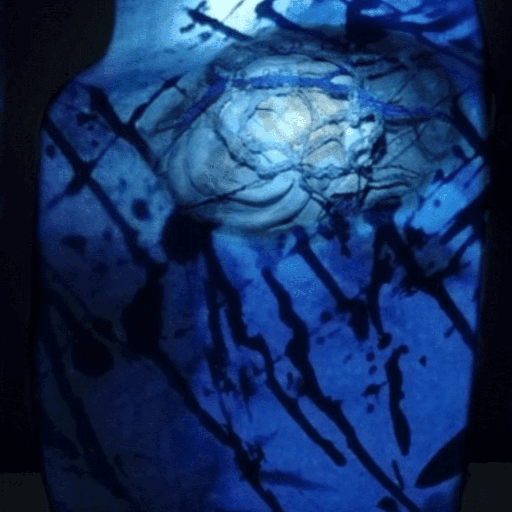 Abstract image of very dark blue and a lighter blue with splatter marks.