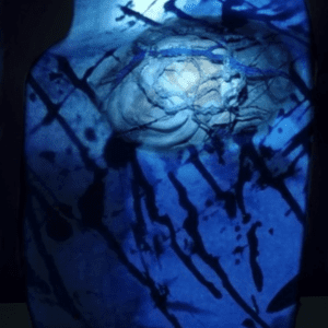 Abstract image of very dark blue and a lighter blue with splatter marks.