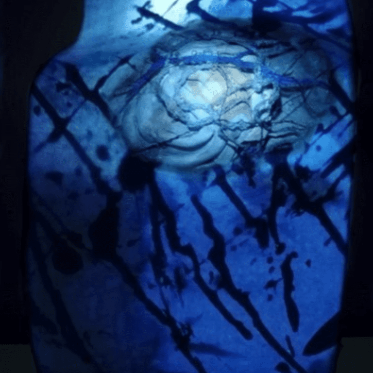 Abstract image of very dark blue and a lighter blue with splatter marks.