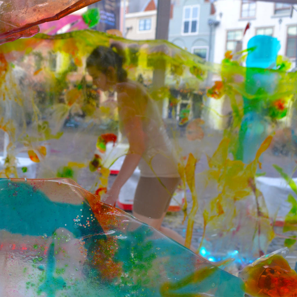 Person walking through installation made of bioplastics