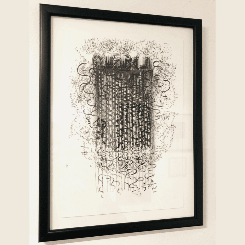 A framed drawing full of lines that make the shape of a weaving, with words interspersed. Drawing is black and grey colours. Frame is black.