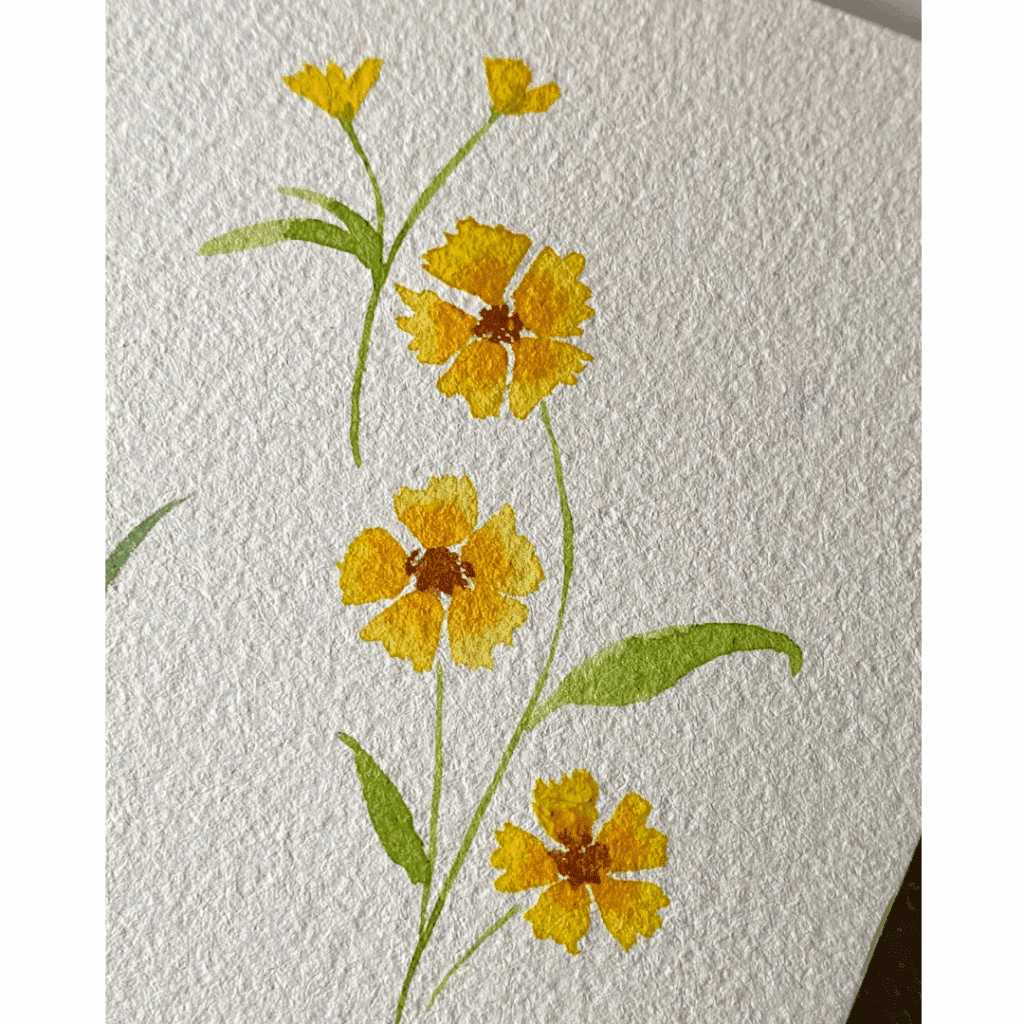 A delicate watercolour painting of small yellow flowers on white paper.