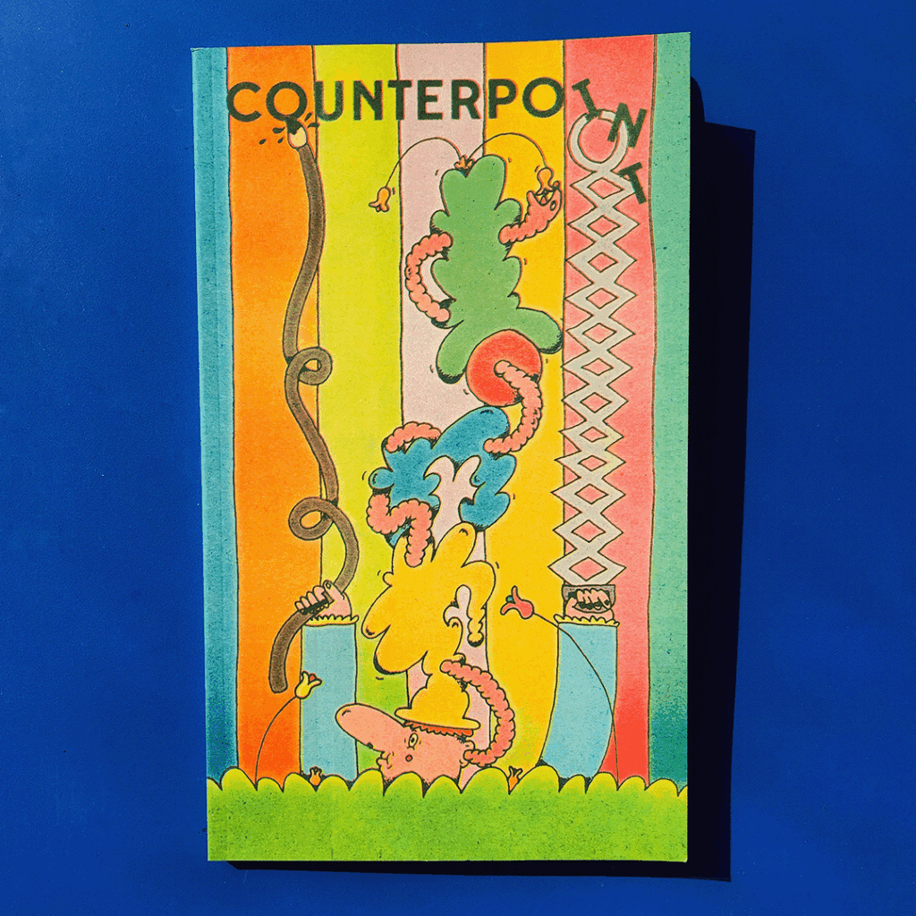 Photograph of a magazine with illustrated cover of a white character with big nose standing in tall grass. They wear a tower of multicoloured hats stacked atop their head. A worm threads it's way between the hats. The characters hold a very long bendy paintbrush and a long grabber, rearranging and painting the letters above that read "COUNTERPOINT". Multicoloured striped wallpaper is behind them.